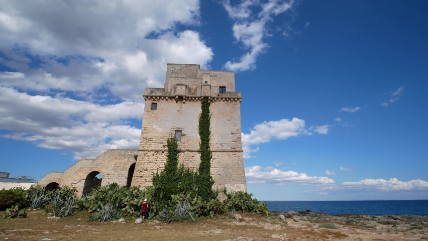 Picturesque historical fortification tower Torre Colimena on Salento Ionian sea coast, Taranto, Puglia, Italy