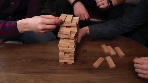 A group of friends plays a board game, team game. High quality FullHD footage