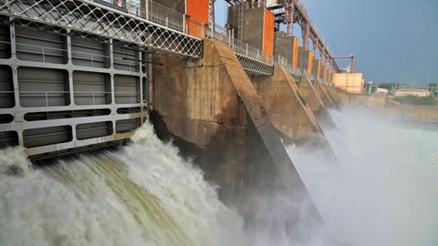 Closeup of massive discharge water from the dam of hydroelectric plant to prevent overflow