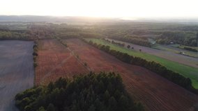 Colorful farmland during the golden hour in the Polish countryside. Video from the drone.