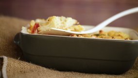 baked cauliflower with chicken fillet and vegetables topped with cheese
