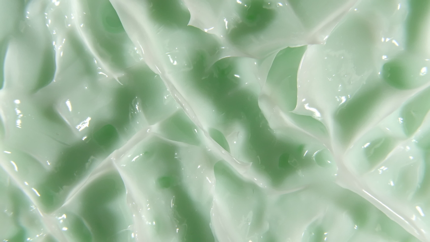Green cream, smear, concealer, cosmetic liquid foundation, cream smudge, makeup brush. Motion, rotation of the beauty skincare product sample. Slow motion | Shutterstock HD Video #1067727113