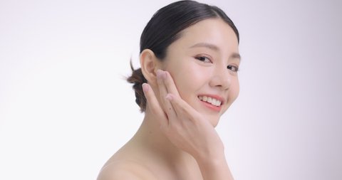 Close Up Of Young Beautiful Asian Woman Touch Her Face Gently With Fingertips.