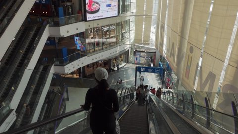Bangkok, Thailand - February 17, 2021 - People on Escalator at Terminal 21 Department Store in Bangkok