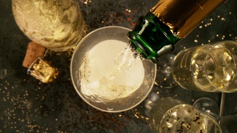 Super slow motion of pouring champagne into glass with camera motion. Filmed on high speed cinema camera, 1000 fps.