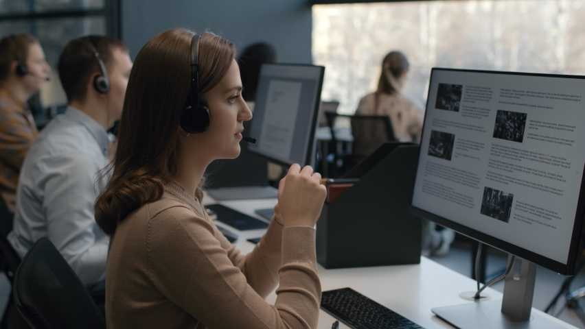 Call center and helpful customer service. Use pc computer and answer questions on phone line at modern co-working. Diverse group of people talks on sale hotline. Busy seller at agency office closeup. | Shutterstock HD Video #1067750939