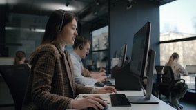 Call center and helpful customer service. Use desktop pc at computer table and phone line at modern co-working. Diverse group of workers talks on sale hotline 24-7. Busy seller at agency office indoor. - Powered by Shutterstock - Get 15% off with code: PIKWIZARD15