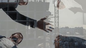 A successful team. Double exposure of many hands holding together against a modern building sky background in slow motion. - Powered by Shutterstock - Get 15% off with code: PIKWIZARD15