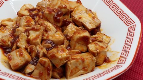 Mapo tofu is one of the famous dishes from the Sichuan region of China. This picture shows the Japanese version of Mapo-Doufu; in Japan, the spiciness is slightly reduced.