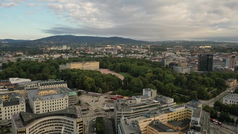 Oslo, Norway. Beautiful 4K panoramic aerial video from flying drone to of the Royal Palace and Statue of King Karl Johan Oslo. In the background the castle park, the city and the mountains (Series)