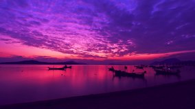 Romantic colorful sunrise at the sea Beautiful pastel clouds moving away rolling Majestic summer landscape. Exploring beauty world. travel and holiday background recreation.Slow motion timelapse