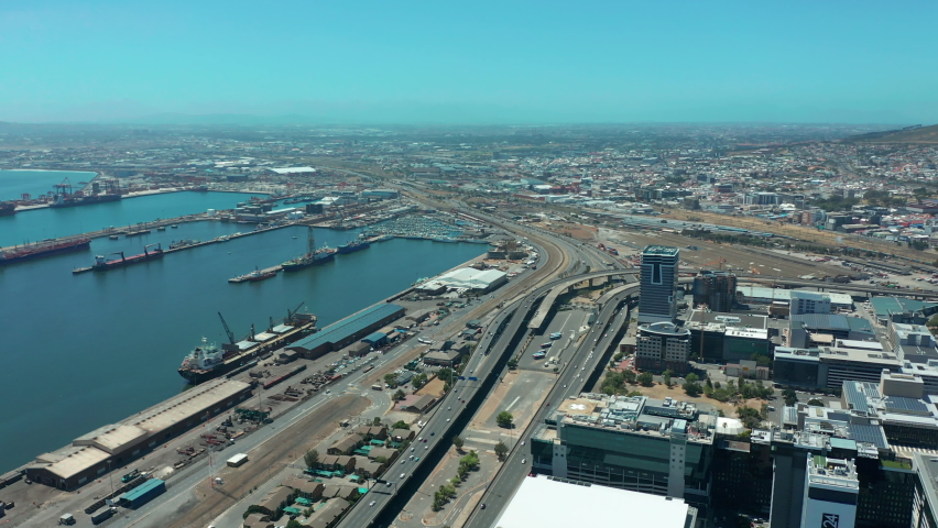 Scenic aerial wide drone shot above central Cape Town, South Africa with scenic view of harbor and downtown business area. Panoramic view of Bo-Kaap, Zonnebloem, Oranjezicht and Table Mountain.