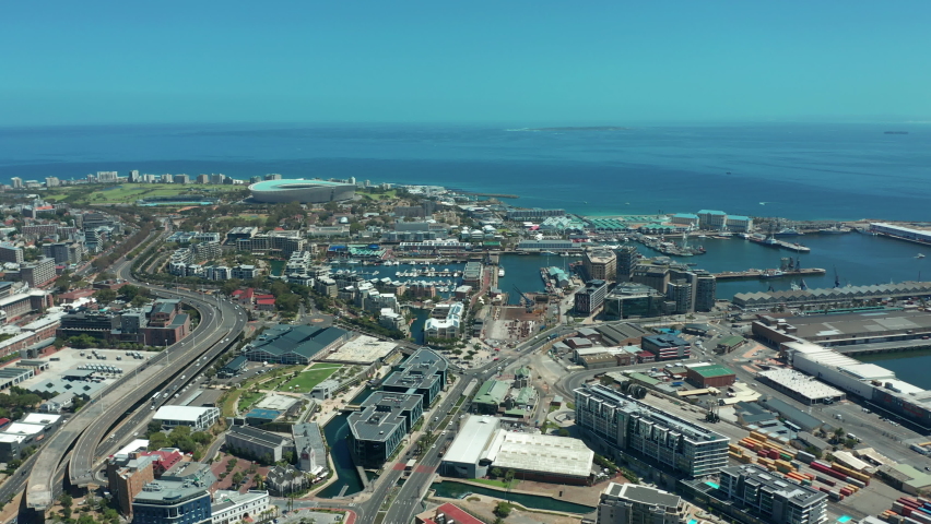 Scenic aerial wide drone shot above central Cape Town, South Africa with scenic view of harbor and downtown business area. Panoramic view of Bo-Kaap, Zonnebloem, Oranjezicht and Table Mountain.