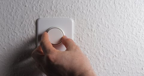 Dimmer with man hand close up