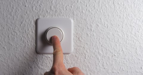 Dimmer button with man hand close up
