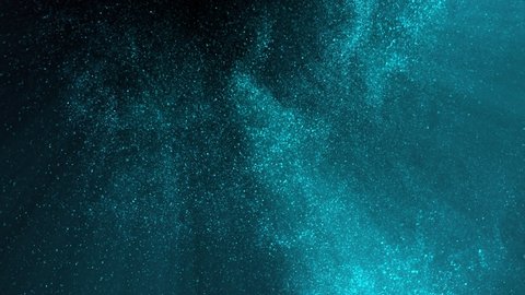 Super Slow Motion Shot of Blue Glittering Atmospheric Particle Background Isolated on Black at 1000 fps.