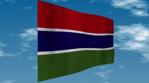 Flag of the Gambia. Clouds are flowing in the background.