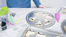 Time lapse. Decorating ice skate shaped sugar cookies with pink color royal icing. - Powered by Shutterstock - Get 15% off with code: PIKWIZARD15