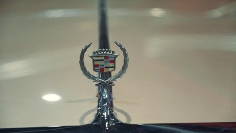 Close-up of Cadillac icon on retro car. Warsaw, Poland - July 10, 2019
