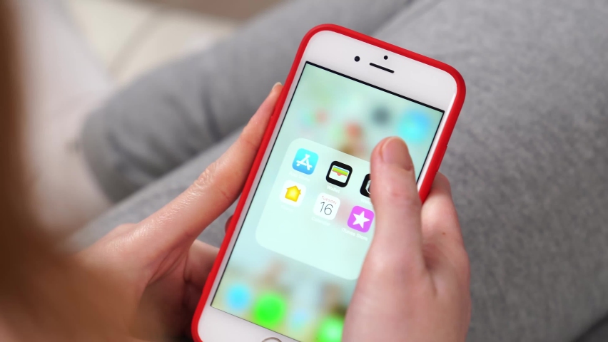 Tiktok. phone in hand. installing a app on a smartphone. service for creating and viewing short videos. free apps for iPhone. Russia, Rostov-on-Don, 17.02.2021 | Shutterstock HD Video #1067784284
