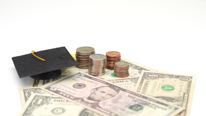 Mortar board, coins and banknotes Royalty-Free Stock Footage #1067793428