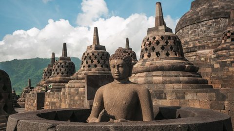 Daytime time lapse view of the ancient ruins of Borobudur, a 9th-century Mahayana Buddhist temple in Magelang Regency near Yogyakarta in Central Java, Indonesia. 