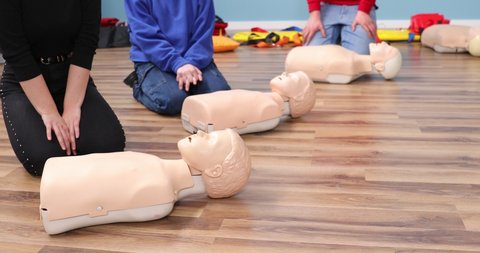 Group of hands, performing cpr on test dolls, cpr and ventilation training