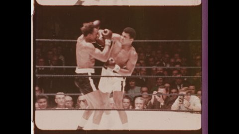 1966 Huston. TX  Muhammad Ali boxing Cleveland Williams. Ali knocks out Williams and Raises Gloves in Iconic Pose. 4K Overscan of Vintage Archival 16mm Film