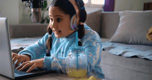 Child girl plays live stream games, chats with friends, online socializing and fun. The lucky girl wins a prize in the game