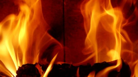 Detail of burning flames in fireplace in Slow Motion HD VIDEO. Natural fire filling full frame of screen. Quarter speed. Close-up.
