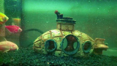 Fish house. Fluorescent Fish Aquarium. Miniature yellow submarine. sunken submarine. 