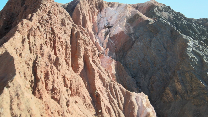 An abandoned magnesium mine sits in ruin along the colorful formations of Afton Canyon, California.