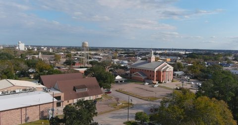 4k aerial view of downtown Katy, Texas. In this establishing shot is a view of Katy City Hall.
