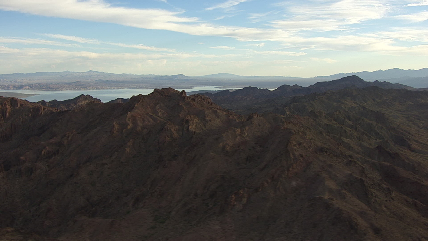 mountains around Lake Mead in the USA. Travel from left to right in a wide angle shot during daylight. helicopter shot with gyrostabilised system