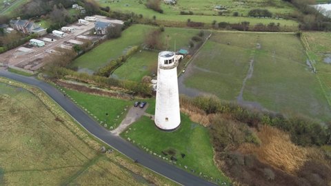 Historic Leasowe Lighthouse maritime beacon landmark aerial coastal countryside Wirral view rising birdseye