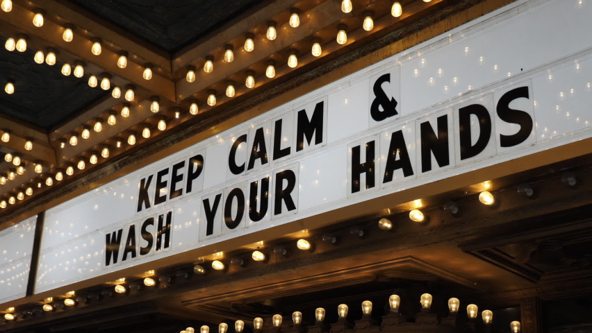 Keep Calm and Wash Your Hands Sign at Entrance of Closed Theatre During Covid-19 Virus Lockdown in USA, Close Up