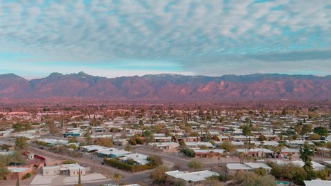Epic drone shot of Tucson Arizona with Tucson Mountains in background