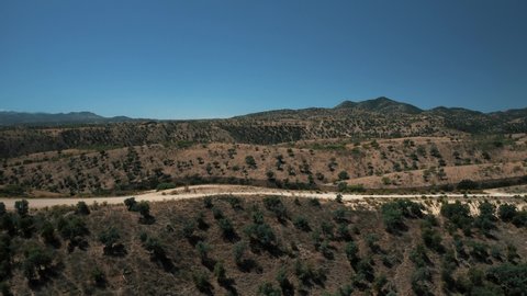 Aerial view of Nogales border area showing border fence separating the United States of America and Mexico with U.S. Border and Customs Protection patrolling border area with their vehicles