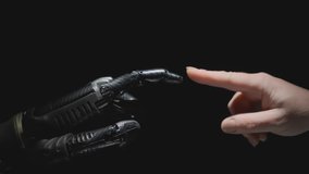 Humanoid robot arm and human hand reach out to each other and touch with fingers on black background. Interaction of artificial intelligence and human mind. - Powered by Shutterstock - Get 15% off with code: PIKWIZARD15