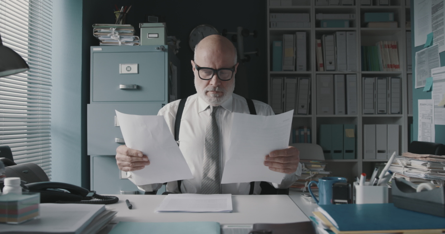Stressed businessman in the office, he is crumpling paper sheets and shouting, job burnout concept | Shutterstock HD Video #1067836247