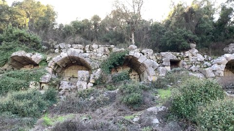 Antalya, Turkey - February 5 2021: Arches of Turkish hammam ruins at Termessos ancient mountain city in the forests of Antalya. Rocks of ancient city during the day