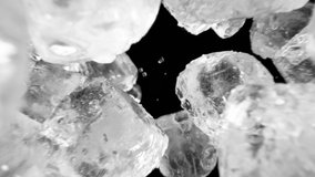 Super slow motion of falling ice cubes isolated on black background. Filmed on high speed cinema camera, 1000 fps. - Powered by Shutterstock - Get 15% off with code: PIKWIZARD15