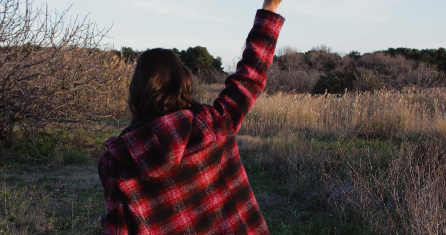 Girl with paper plane and red sweater
