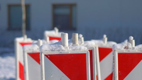 Red-white safety pole post in winter in 4k slow motion 60fps