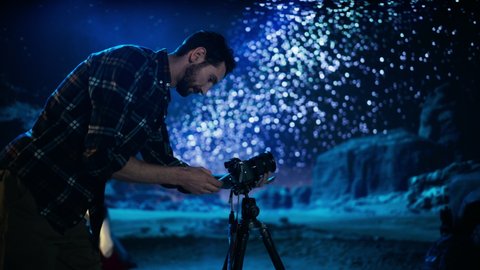 Photographer Prepares His Camera for Starry Night Sky, Astro Photography in the Desert Nightscape. Nature Loving Photo Shoot of Amazing Milky Way Starry Sky, Majestic Marvel of Rocky Canyon Nature