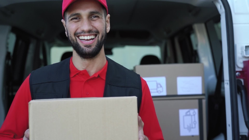 Young delivery man carrying cardboard box - People working with fast deliver transportation Royalty-Free Stock Footage #1067860589