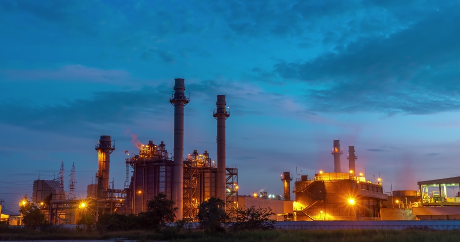 Time-lapse of Industrial area, electricity power supply substation during and petrochemical. oil manufacturing products. power electric plant at night
