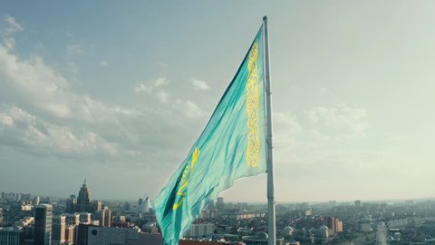 flag of Kazakhstan on the background of the city