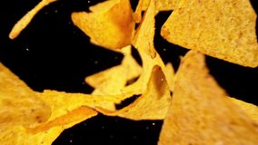 Super Slow Motion Shot of Tortilla Chips Falling on Black Background, 1000fps. - Powered by Shutterstock - Get 15% off with code: PIKWIZARD15