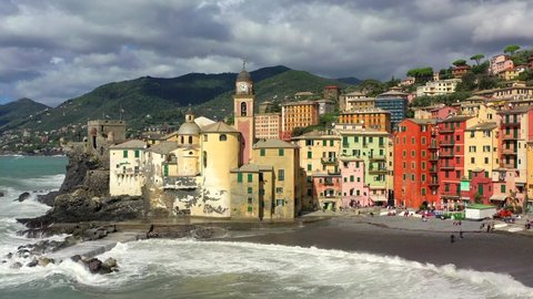Camogli in Liguria with the stormy sea. Aerial view with drone of the characteristic seaside village. Genoa. 